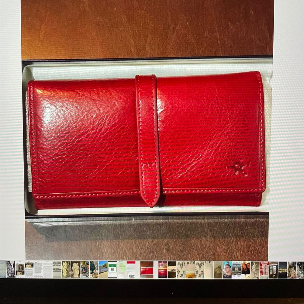 New. Red leather wallet made in Rome, Italy.
